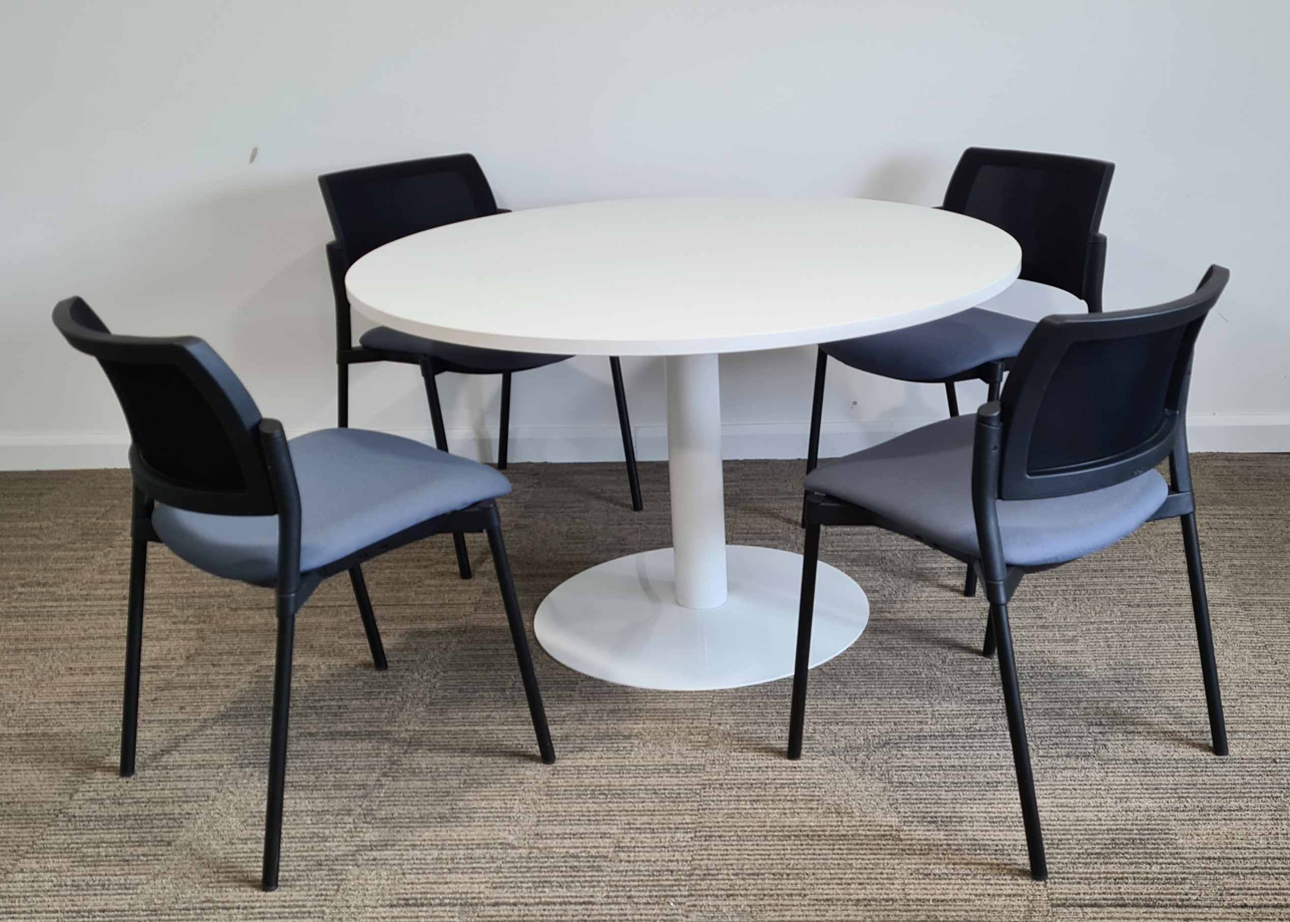 Used Round White Table with 4 Grey Stacking Chairs